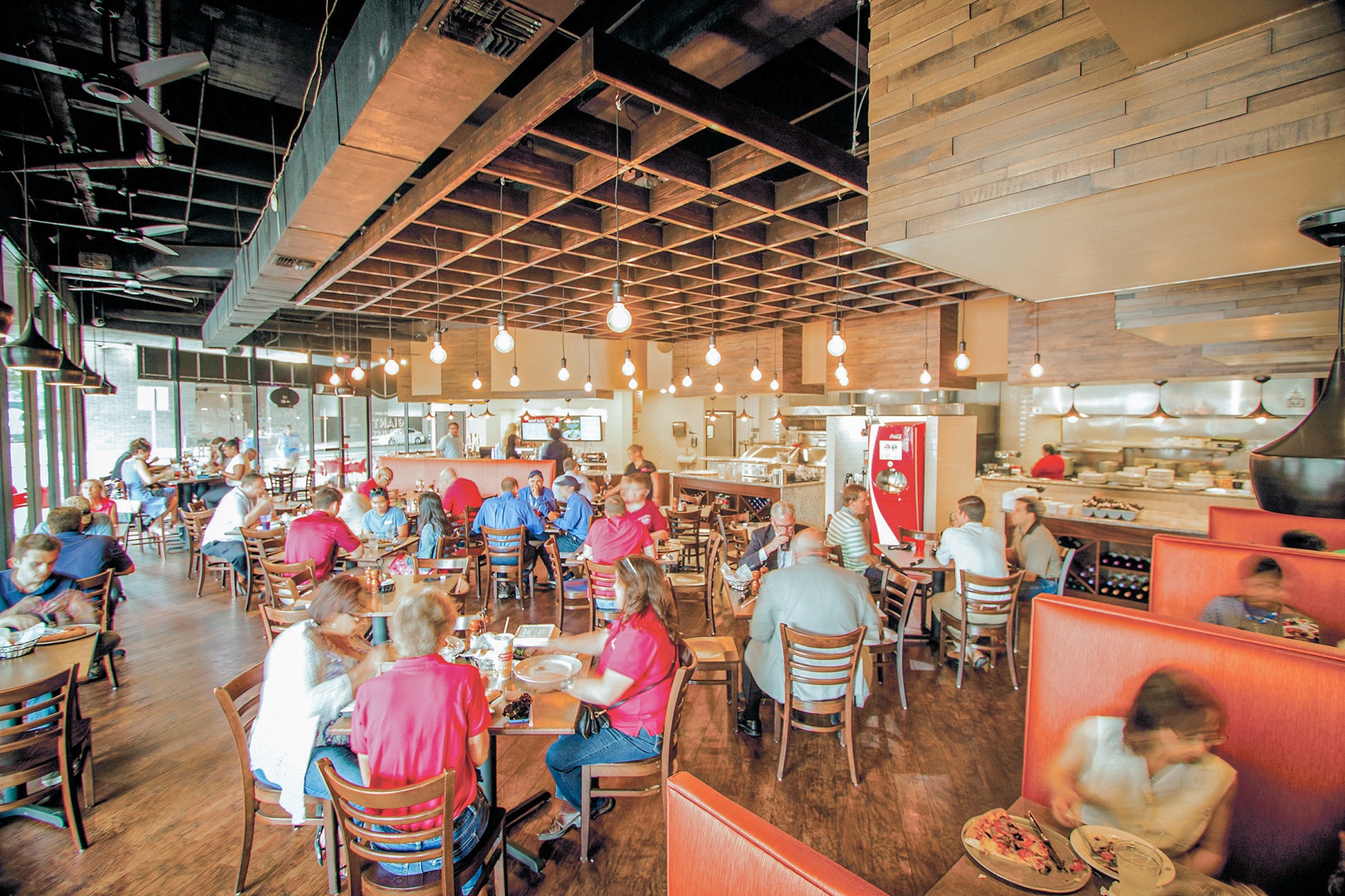 Families dining inside a Russo's New York Pizzeria & Italian Kitchen